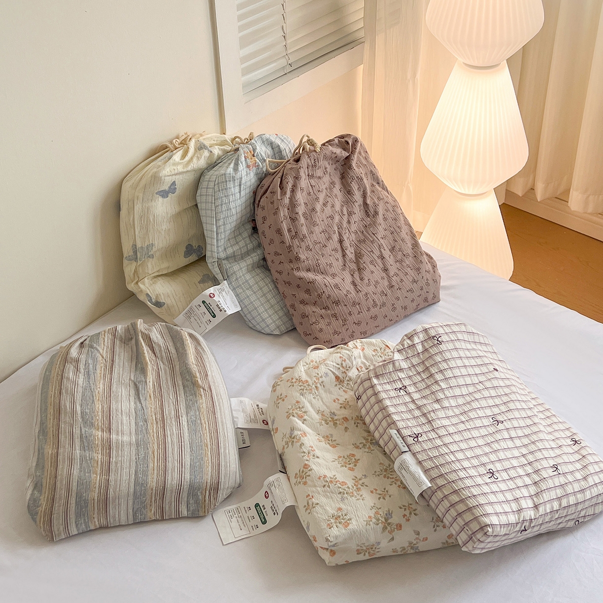 91家纺网 家纺一手货源 找家纺 一比一 2025新款古法水洗棉小布袋高克重云柔棉四件套 小布袋包装