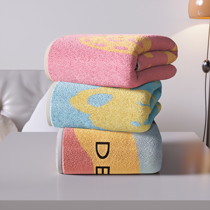 91家纺网 家纺一手货源 找家纺 悦然毛巾被 2025新款全棉色织提花毛圈浴巾 熊头粉黄 70x140cm