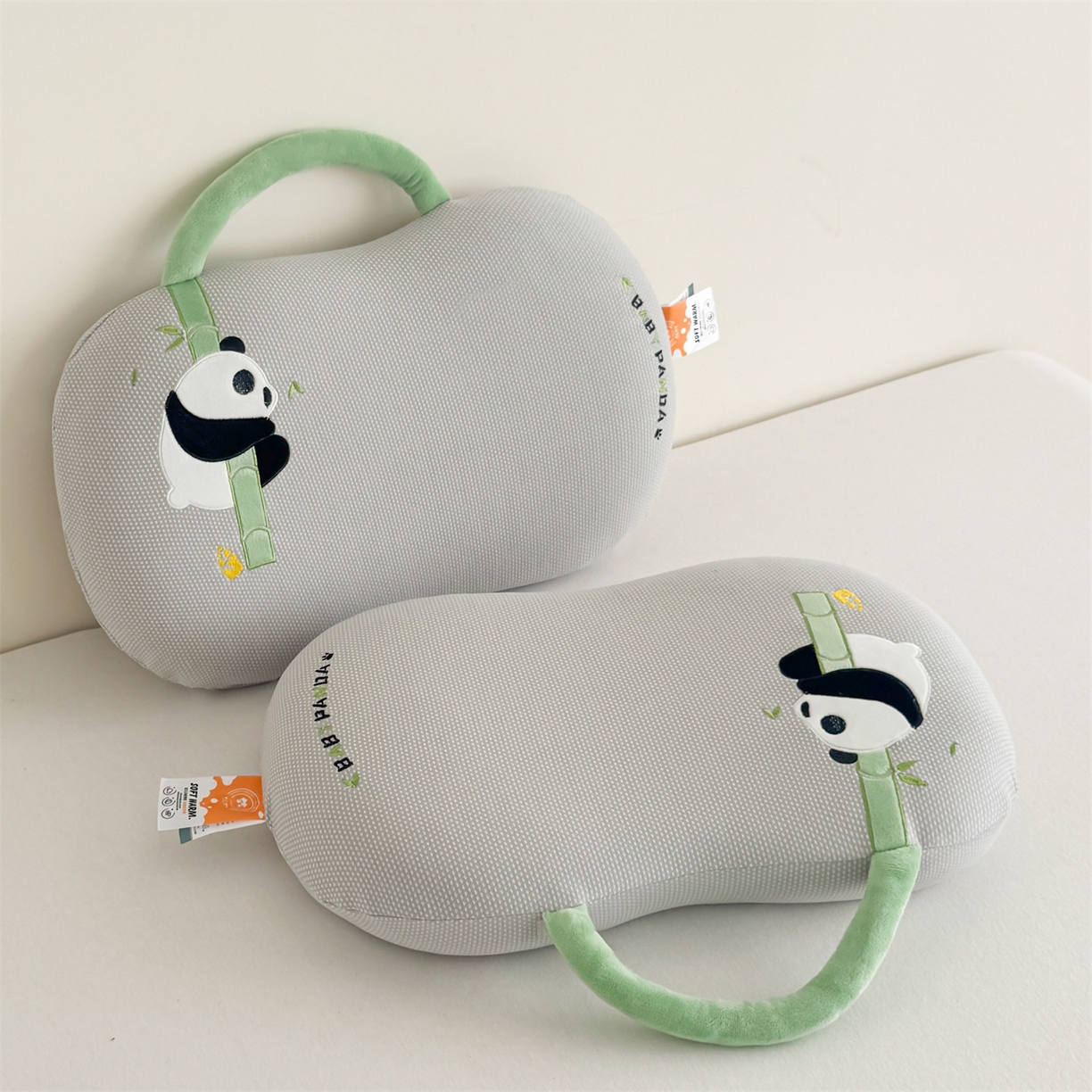 91家纺网 家纺一手货源 找家纺 麦肯锡 2025新款暖绒手提熊猫猫肚枕 枕头枕芯 灰色