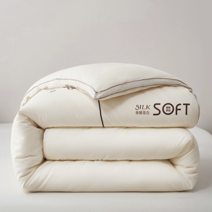 91家纺网 家纺一手货源 找家纺 蓝雀翎 2025新款木棉提花蚕蛹蛋白被子被芯 米白