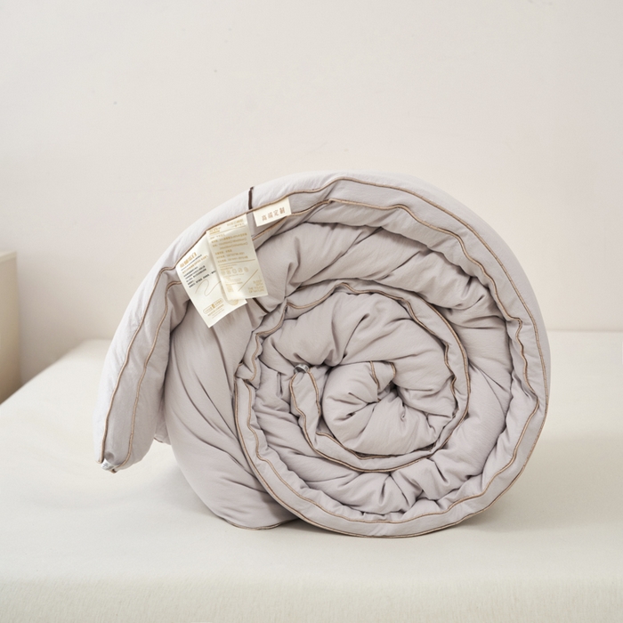 91家纺网 家纺一手货源 找家纺 蓝雀翎 2025新款木棉提花蚕蛹蛋白被子被芯 灰色