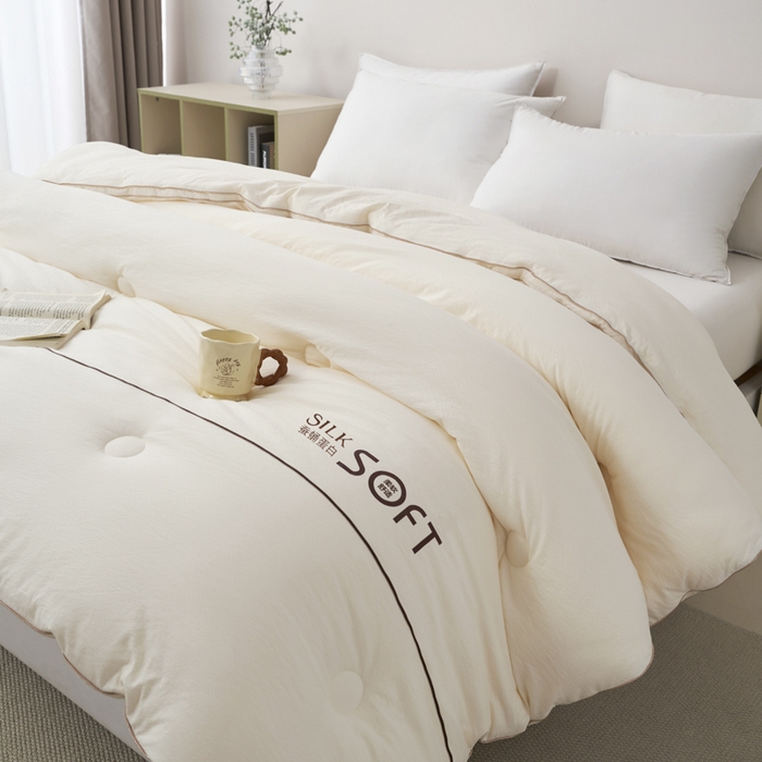 91家纺网 家纺一手货源 找家纺 蓝雀翎 2025新款木棉提花蚕蛹蛋白被子被芯 米白