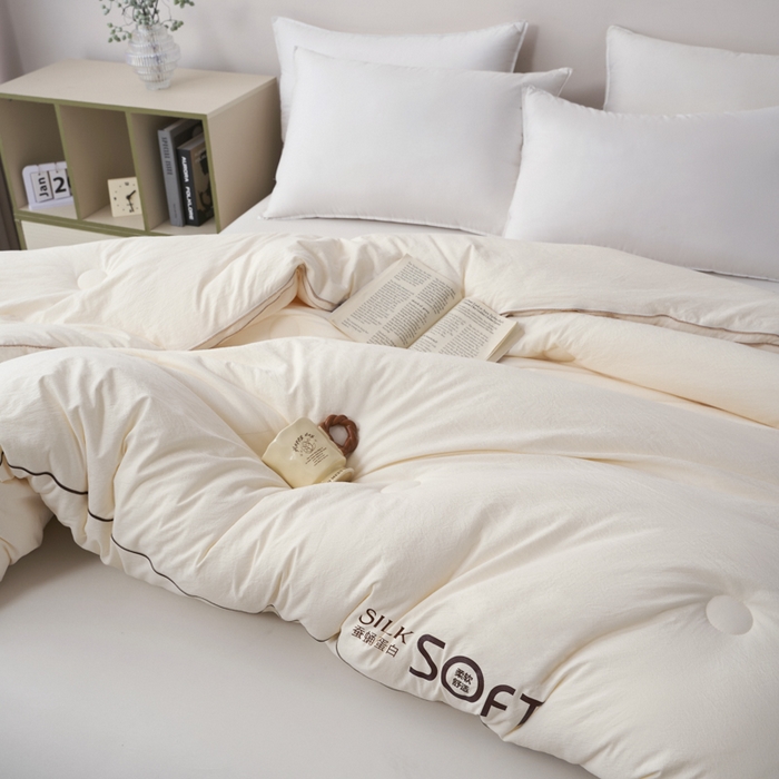 91家纺网 家纺一手货源 找家纺 蓝雀翎 2025新款木棉提花蚕蛹蛋白被子被芯 米白