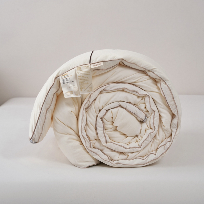 91家纺网 家纺一手货源 找家纺 蓝雀翎 2025新款木棉提花蚕蛹蛋白被子被芯 米白