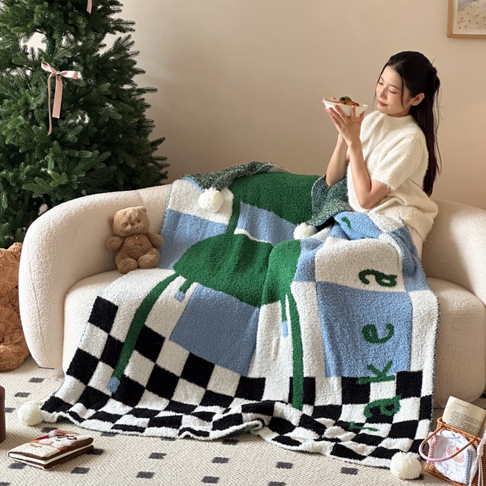 91家纺网 家纺一手货源 找家纺 Sweet dreams甜梦 2025新款轻奢高端毛球款半边绒针织毛毯 绿格子椅子