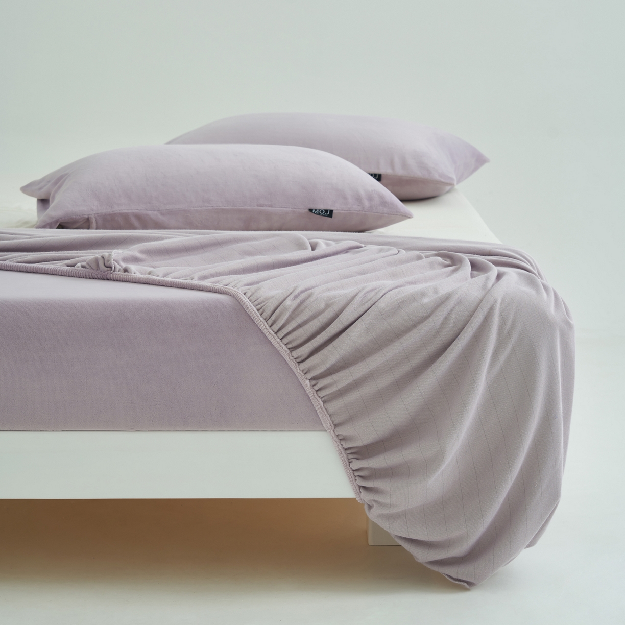 91家纺网 家纺一手货源 找家纺 寐绸家纺 2025新款牛奶绒纯色暖绒床笠 暖绒床笠-淡紫