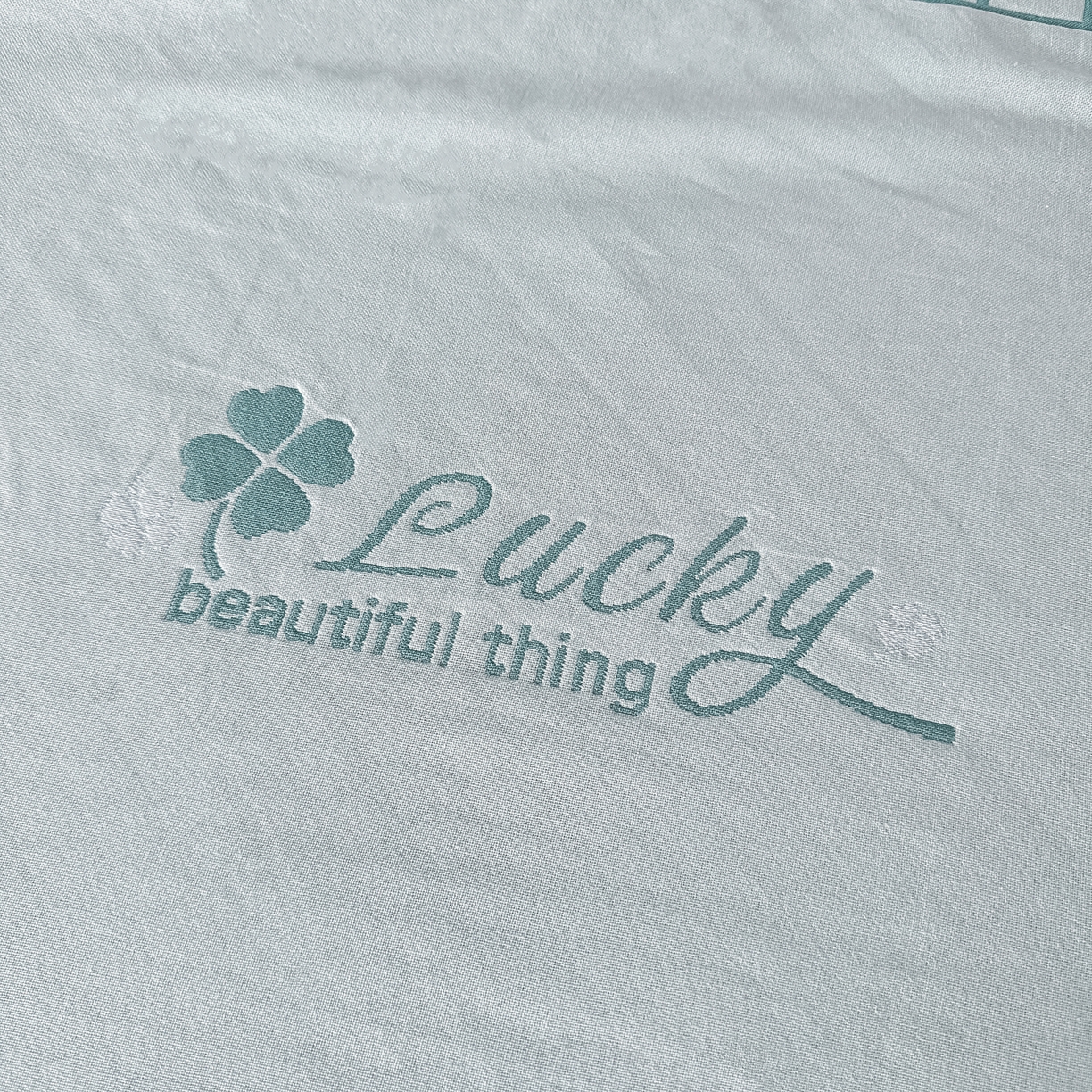 91家纺网 家纺一手货源 找家纺 沐瑟家纺 2025新款馨梦枕巾 四叶草-湖蓝 52x75cm枕巾一对