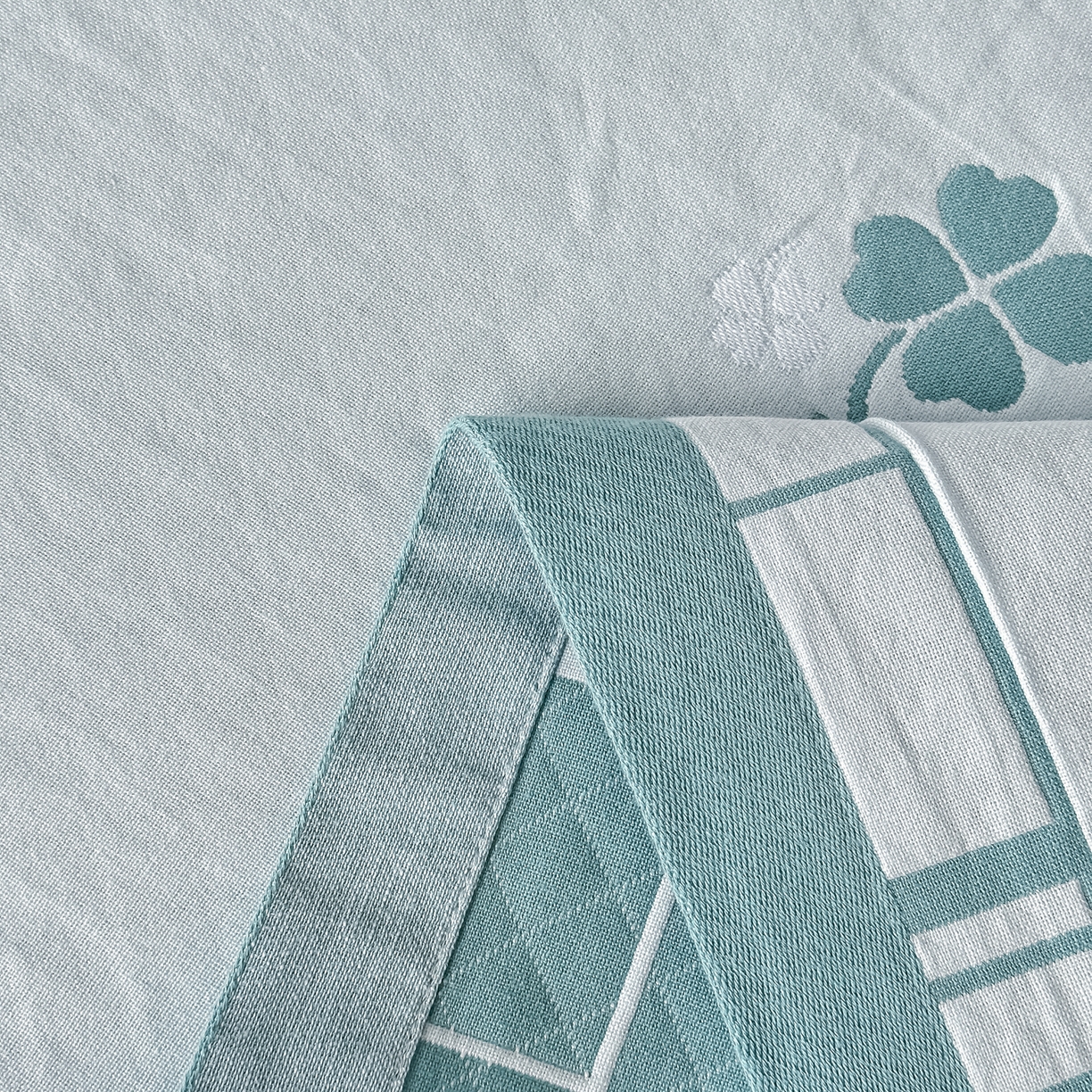 91家纺网 家纺一手货源 找家纺 沐瑟家纺 2025新款馨梦枕巾 四叶草-湖蓝 52x75cm枕巾一对