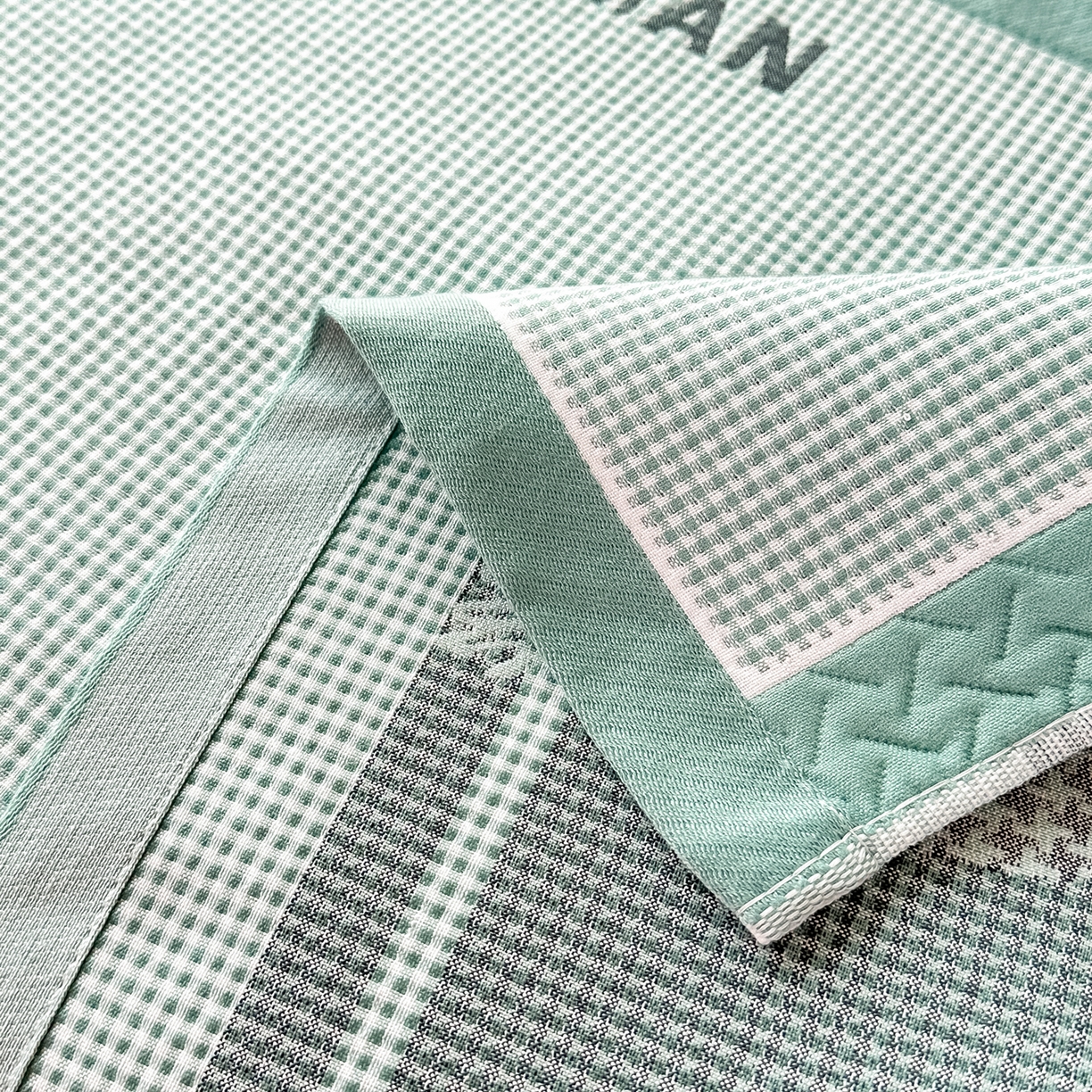 91家纺网 家纺一手货源 找家纺 沐瑟家纺 2025新款亲肤柔软纱布小米格枕巾 M兔-绿色 52*78cm枕巾/对