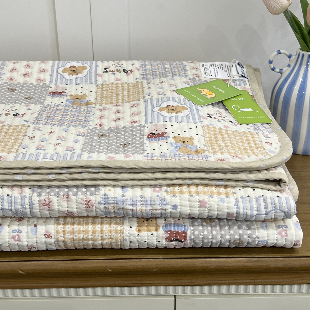 91家纺网 家纺一手货源 找家纺 沐纯家居 2025新款跑量款双面纯棉 棉花填充水洗床盖 拼格小熊