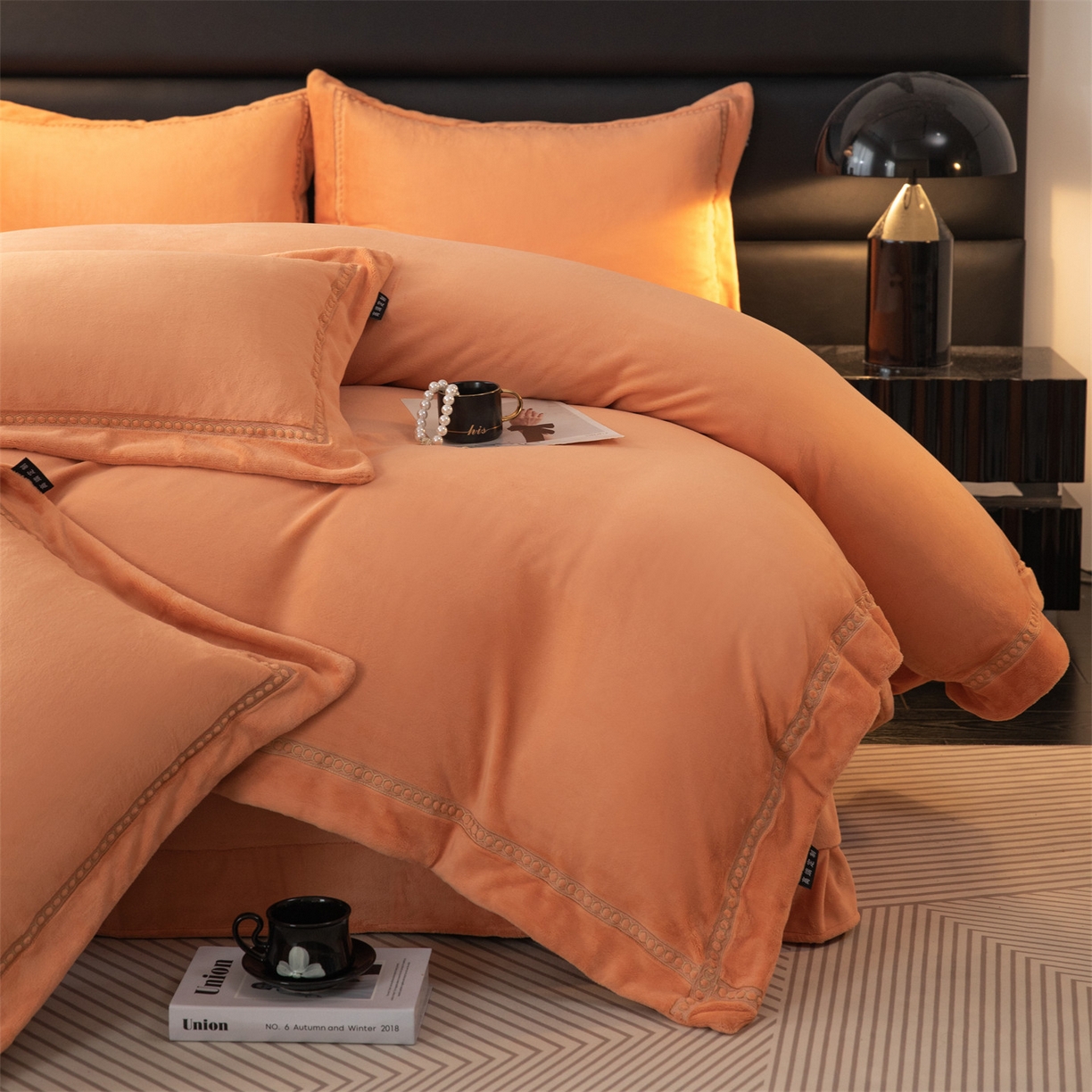 91家纺网 家纺一手货源 找家纺 暖洋家纺 2025新款暖芙绒纯色刺绣款套件四件套 爱玛橙