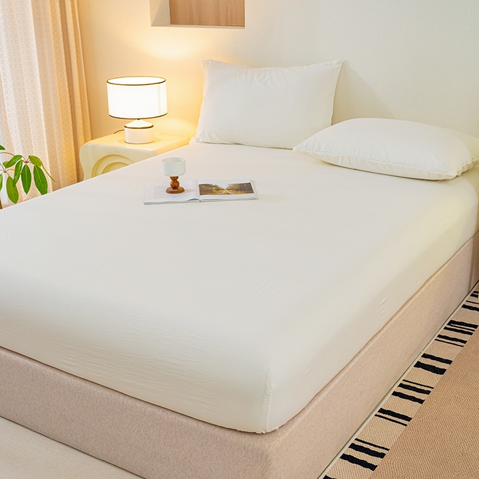 91家纺网 家纺一手货源 找家纺 桔禾家纺 2025新款水洗皱皱云感棉纯色床笠 奶油白