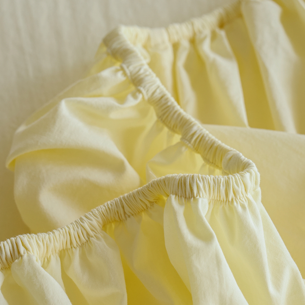 91家纺网 家纺一手货源 找家纺 轩和家居 2025新款全棉高支旧感砂洗长绒棉单床笠 淡黄色