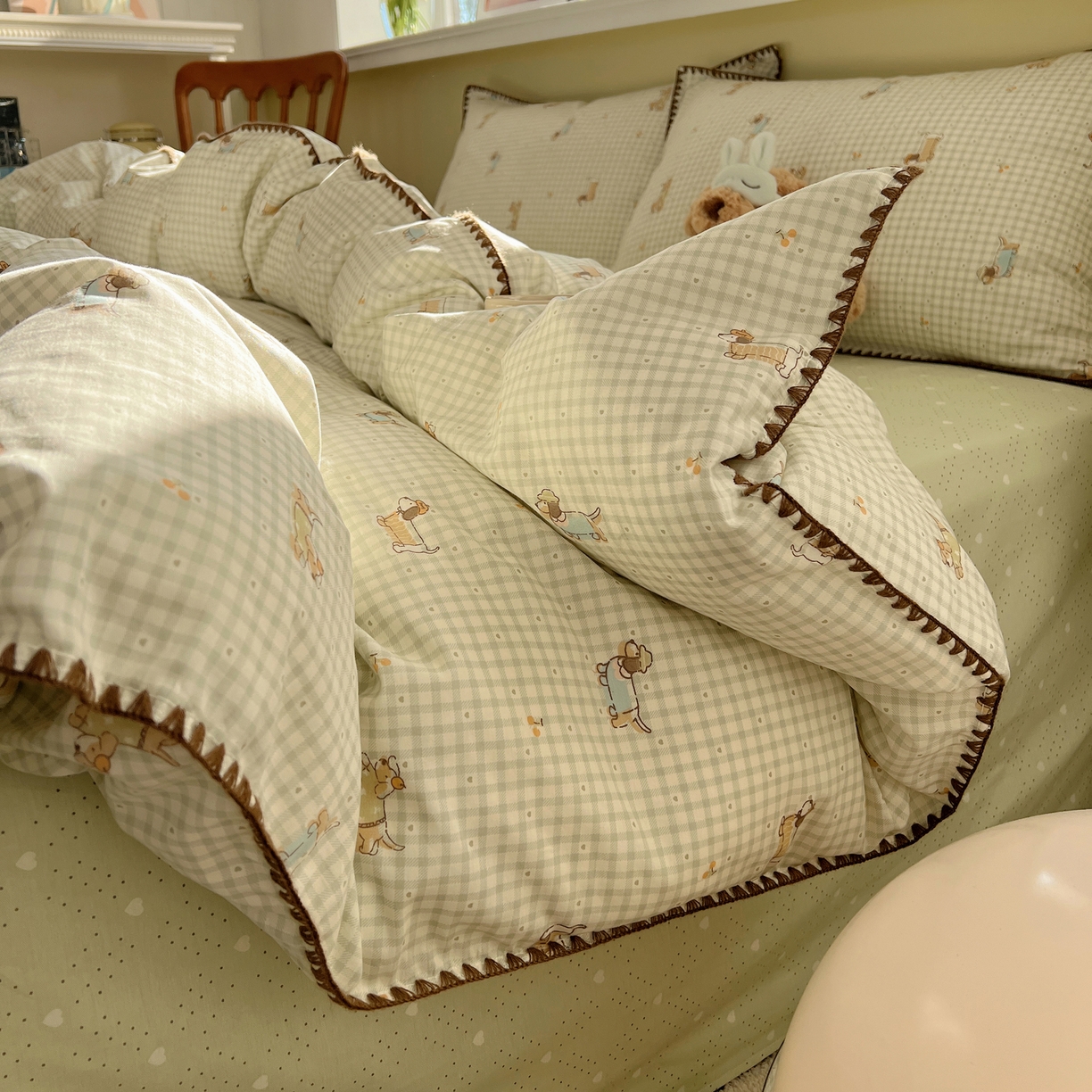 91家纺网 家纺一手货源 找家纺 瑞莱 2026新款全棉印花贝壳边四件套 活泼小狗