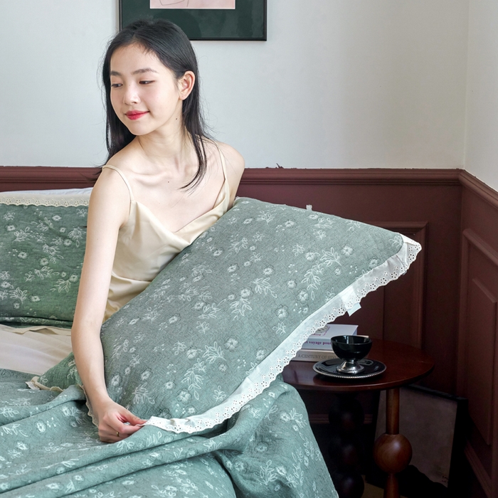 91家纺网 家纺一手货源 找家纺 棠薇家纺 2025新款花边款枕巾提花枕巾 花边春意绿