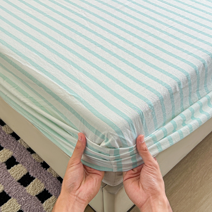 91家纺网 家纺一手货源 找家纺 佳笠家居 2026年新款kimi熊a类全棉色织水洗棉大尺寸单床笠 野原-绿