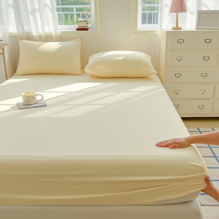 91家纺网 家纺一手货源 找家纺 温眠家纺 2025新款纯色格子高克重水洗棉床笠全包围防滑床罩保护套单床笠 奶黄