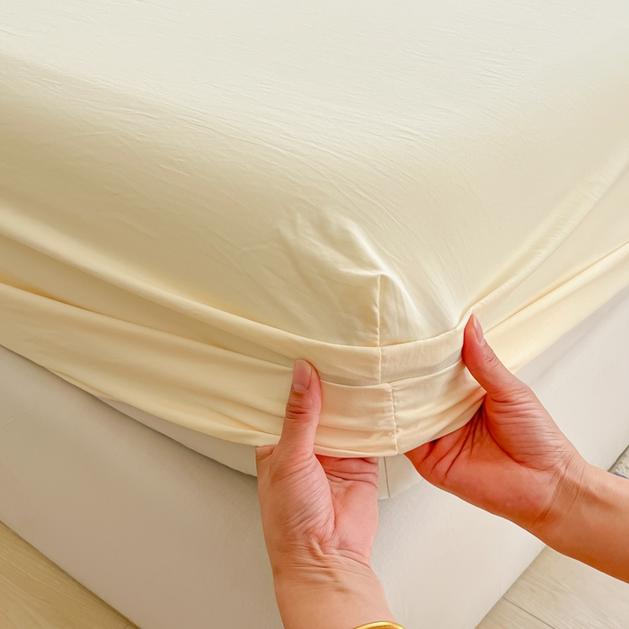 91家纺网 家纺一手货源 找家纺 温眠家纺 2025新款纯色格子高克重水洗棉床笠全包围防滑床罩保护套单床笠 奶黄