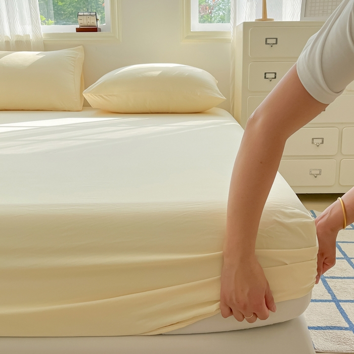 91家纺网 家纺一手货源 找家纺 温眠家纺 2025新款纯色格子高克重水洗棉床笠全包围防滑床罩保护套单床笠 奶黄