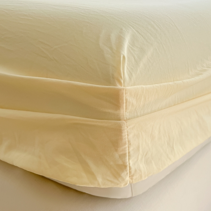 91家纺网 家纺一手货源 找家纺 温眠家纺 2025新款纯色格子高克重水洗棉床笠全包围防滑床罩保护套单床笠 奶黄