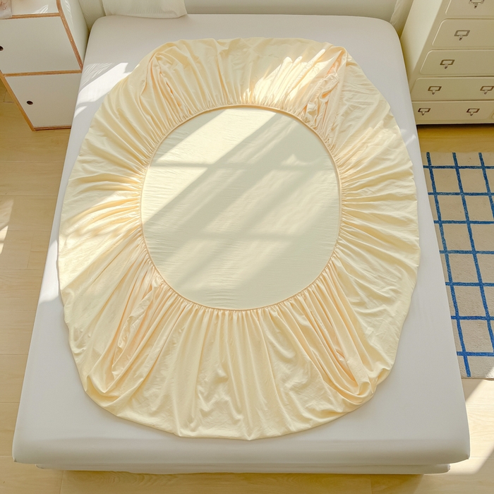 91家纺网 家纺一手货源 找家纺 温眠家纺 2025新款纯色格子高克重水洗棉床笠全包围防滑床罩保护套单床笠 奶黄