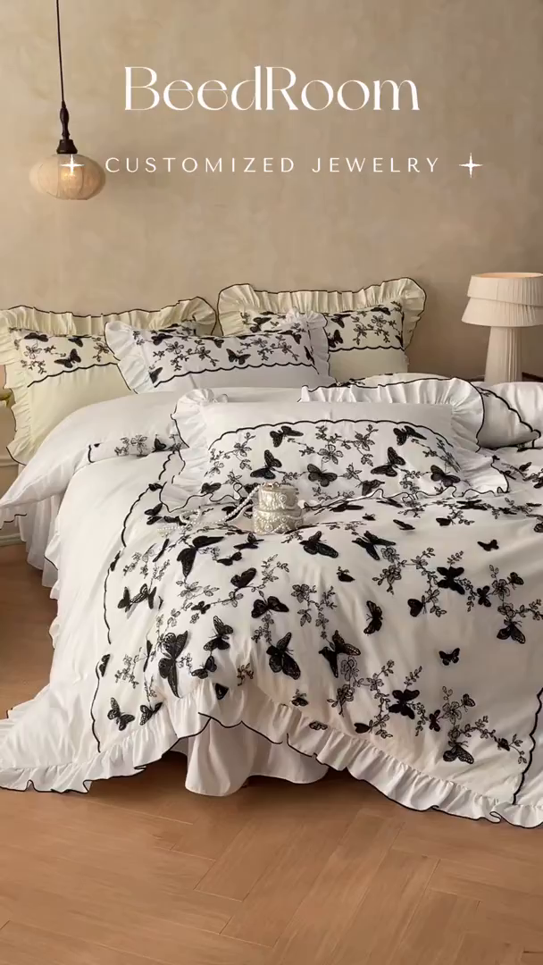 91家纺网 家纺一手货源 找家纺 乐卧家居 2026新款130克磨毛法式宫廷感浪漫精致刺绣丝黑蝴蝶荷边四件套-蝶梦 蝶梦-白