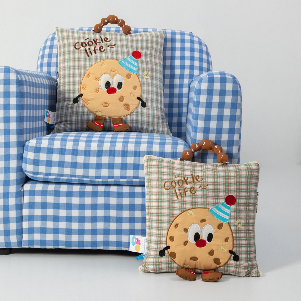 91家纺网 家纺一手货源 找家纺 雷娜家居 2026新款水洗棉手提款曲奇抱枕被 水洗棉饼干香草绿