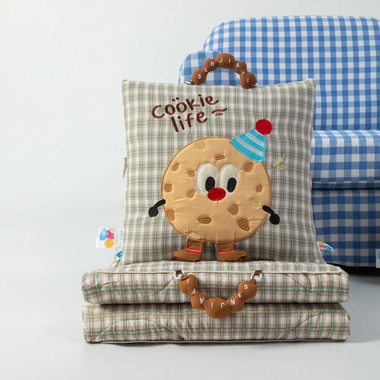 91家纺网 家纺一手货源 找家纺 雷娜家居 2026新款水洗棉手提款曲奇抱枕被 水洗棉饼干香草绿