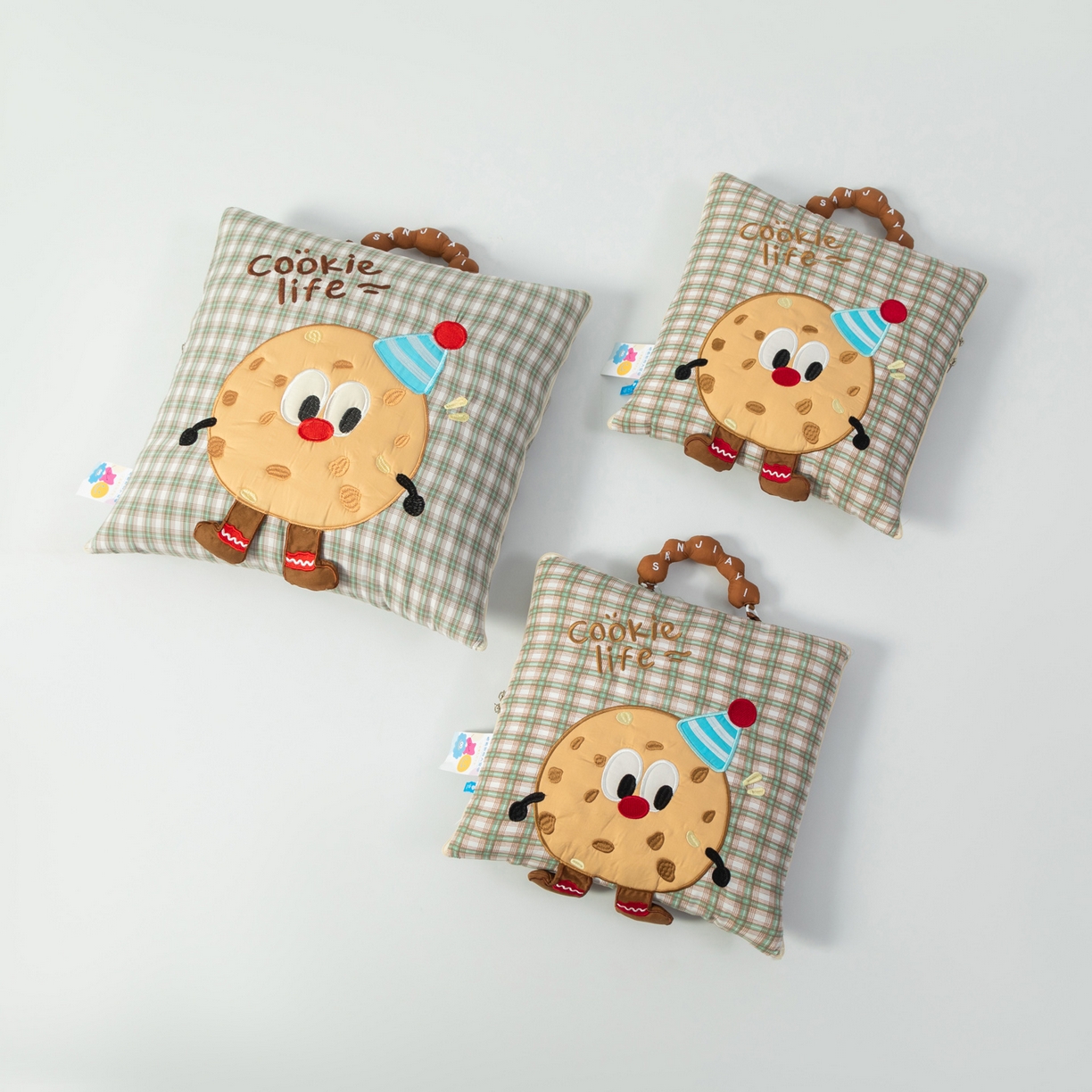 91家纺网 家纺一手货源 找家纺 雷娜家居 2026新款水洗棉手提款曲奇抱枕被 水洗棉饼干香草绿