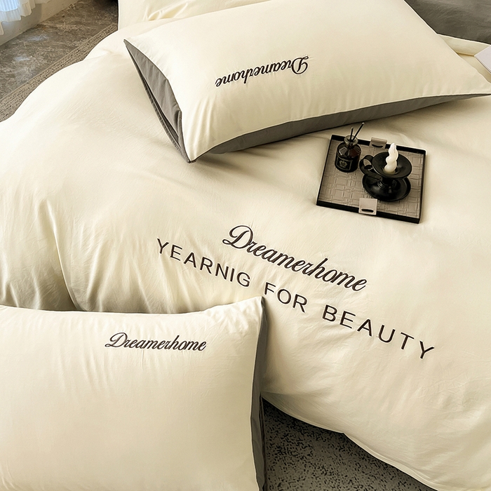 91家纺网 家纺一手货源 找家纺 鑫利来家纺 2026新款古法仿棉水洗云朵棉刺绣单枕套纯色双拼水洗磨毛简约字母刺绣枕套 慕斯-奶白+中灰