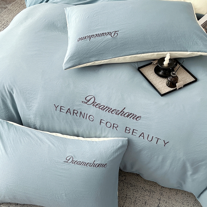 91家纺网 家纺一手货源 找家纺 鑫利来家纺 2026新款古法仿棉水洗云朵棉刺绣单枕套纯色双拼水洗磨毛简约字母刺绣枕套 慕斯-海清+奶白