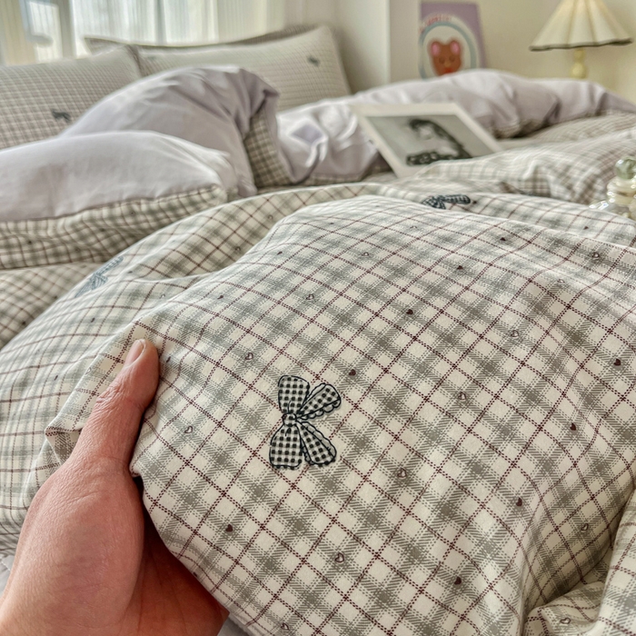 91家纺网 家纺一手货源 找家纺 尚美 2026新款简约印花床盖四件套 格子蝴蝶结