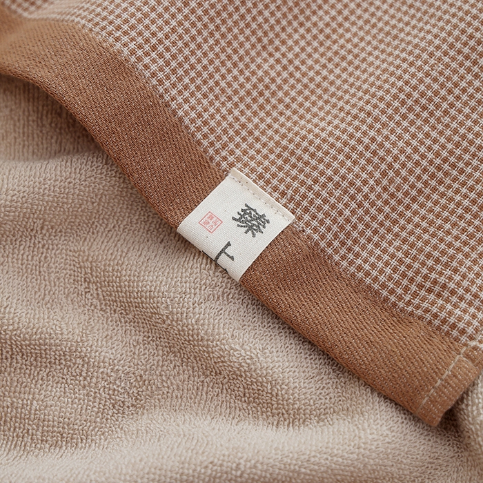 91家纺网 家纺一手货源 找家纺 朴尔家纺-毛巾被 2026新款全棉无印风纱布毛圈加厚色织提花枕巾 毛圈双面枕巾-咖小格
