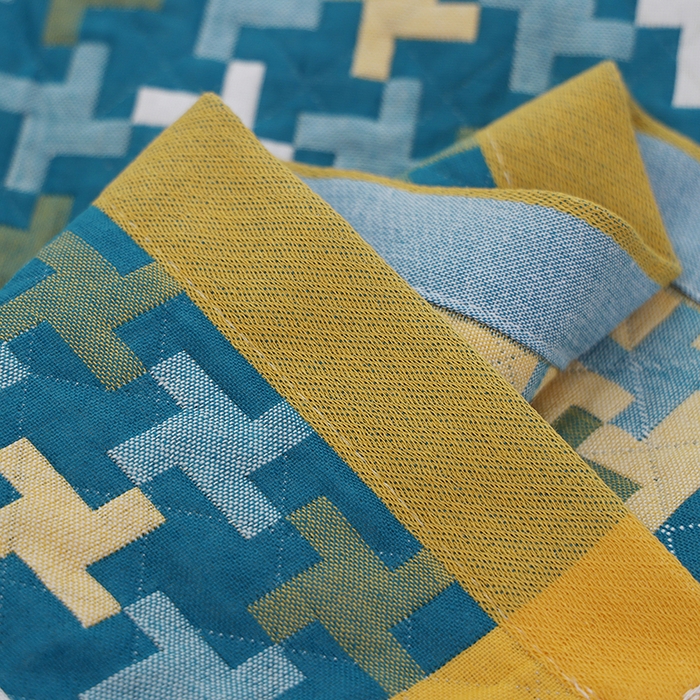 91家纺网 家纺一手货源 找家纺 朴尔家纺-毛巾被 2026新款全棉色织提花宽边定位四层纱布枕巾 阳光风车-绿