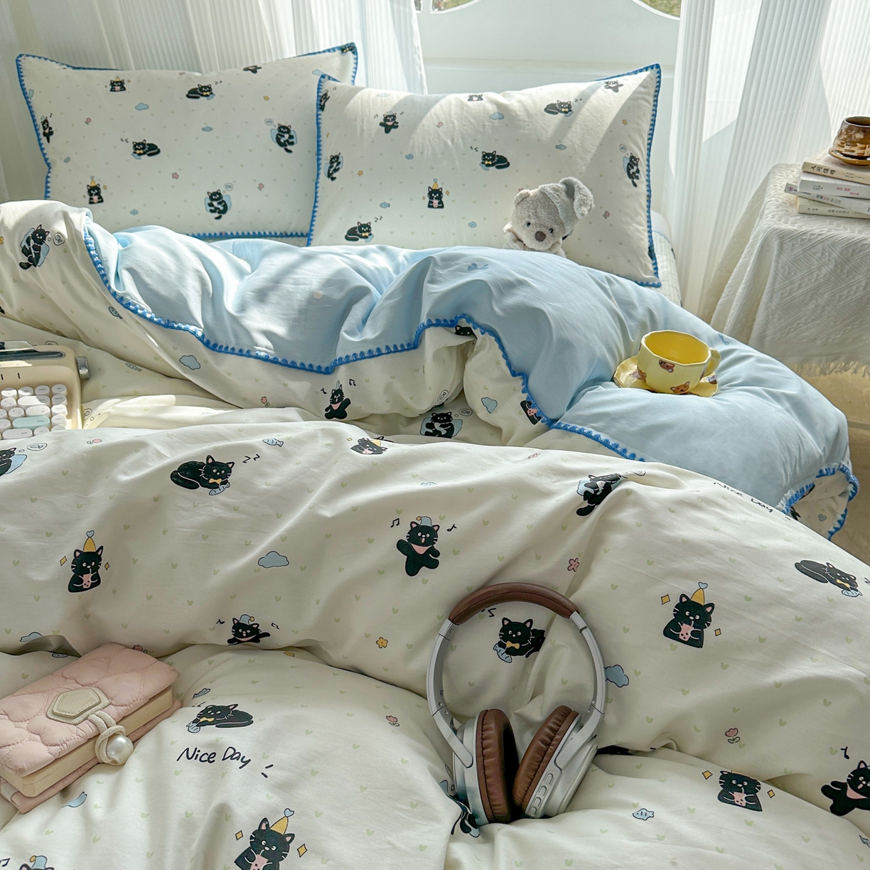 91家纺网 家纺一手货源 找家纺 KA家纺 2026春夏新款全棉纯棉床盖款卡通印花贝壳边四件套 贪睡猫