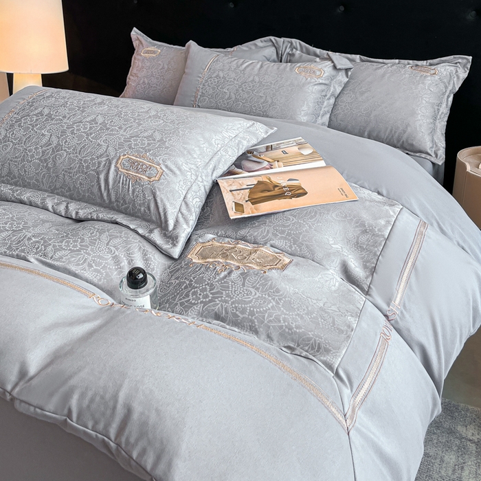 91家纺网 家纺一手货源 找家纺 金牛座家纺 2026新款贡缎提花亲肤棉大拼角刺绣四件套-欧诺 欧诺-灰