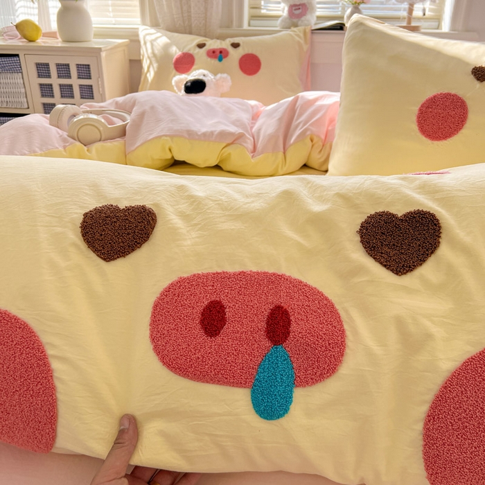 91家纺网 家纺一手货源 找家纺 颜选 2026春夏新款卡通款水洗棉毛巾绣四件套-猪猪 猪猪女孩-黄