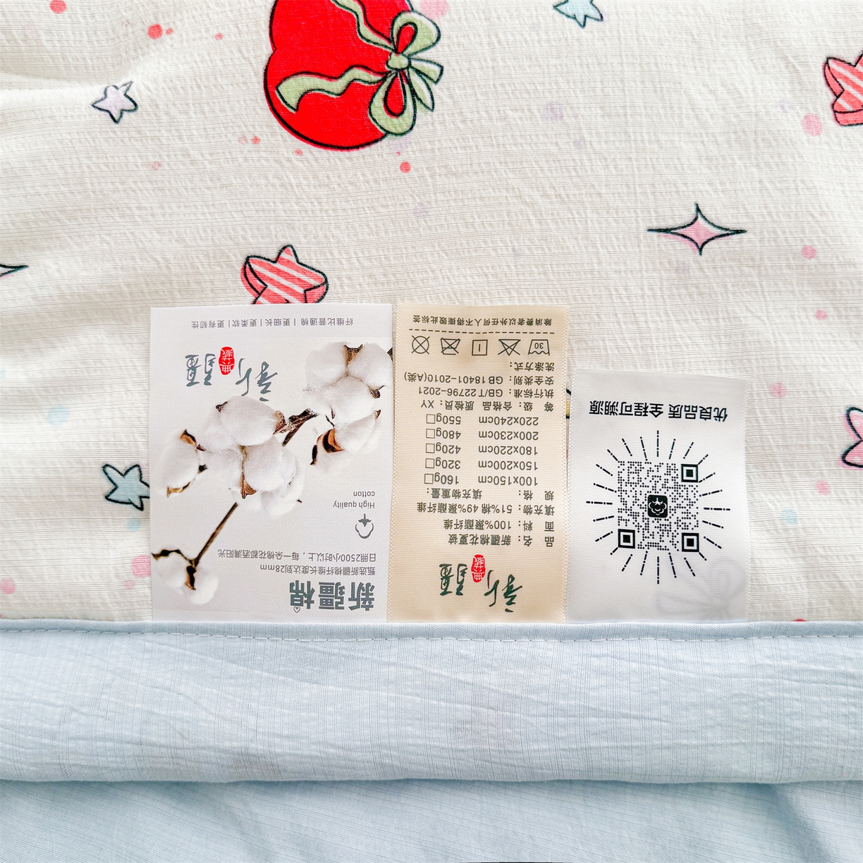 91家纺网 家纺一手货源 找家纺 2026新款A类新疆棉花夏凉被加宽包边水洗棉卡通印花吸湿透气棉花夏被空调被 云感红苹果