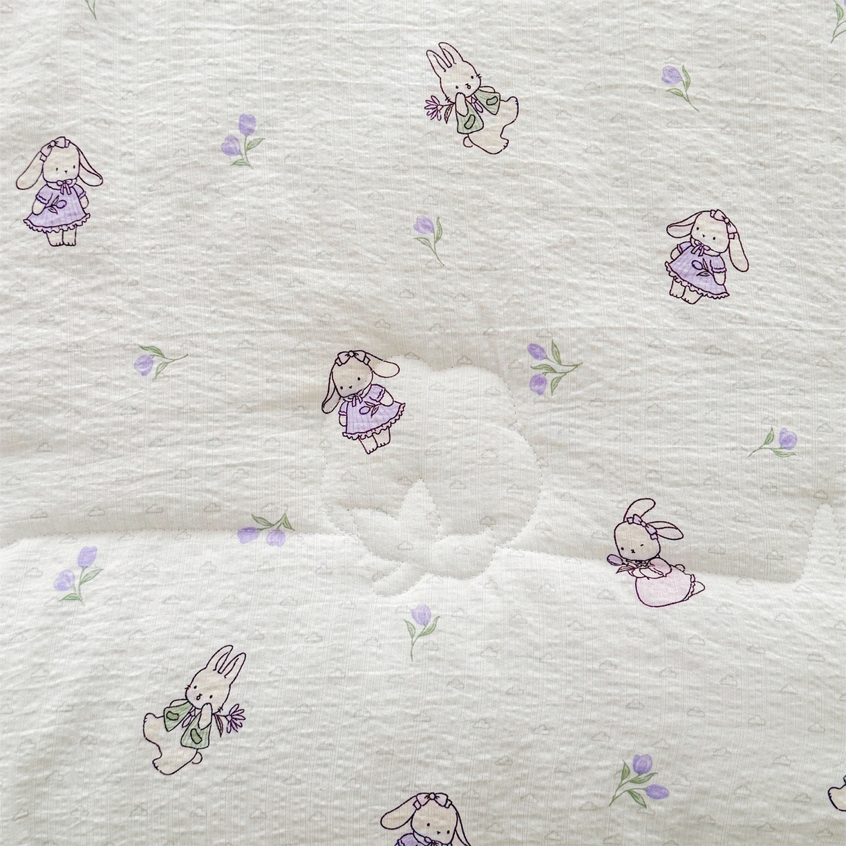 91家纺网 家纺一手货源 找家纺 2026新款A类新疆棉花夏凉被加宽包边水洗棉卡通印花吸湿透气棉花夏被空调被 云感郁金兔