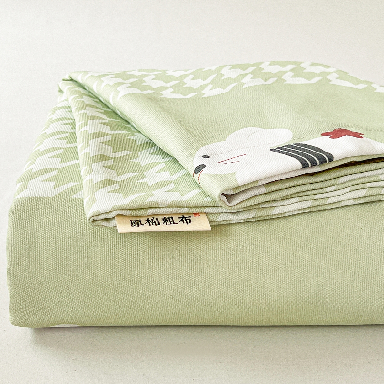 91家纺网 家纺一手货源 找家纺 纽缦家纺 2026新款舒适透气细沙卡通印花老粗布床单凉席席子 田园小兔-绿