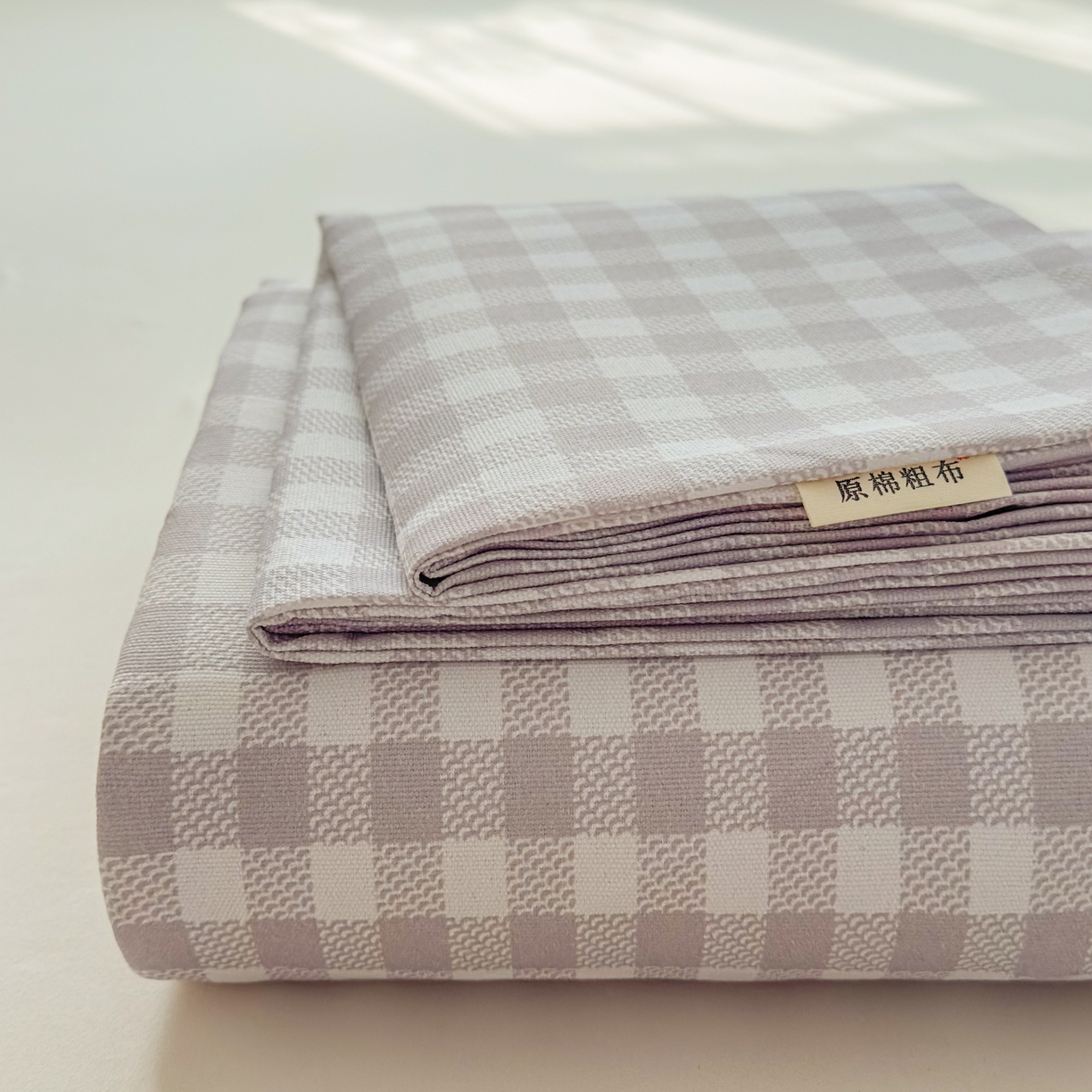 91家纺网 家纺一手货源 找家纺 爱彼家纺 2026新款无印格子分老粗布床单软凉席床单枕套三件套新升级细沙-格子系列一 格子灰