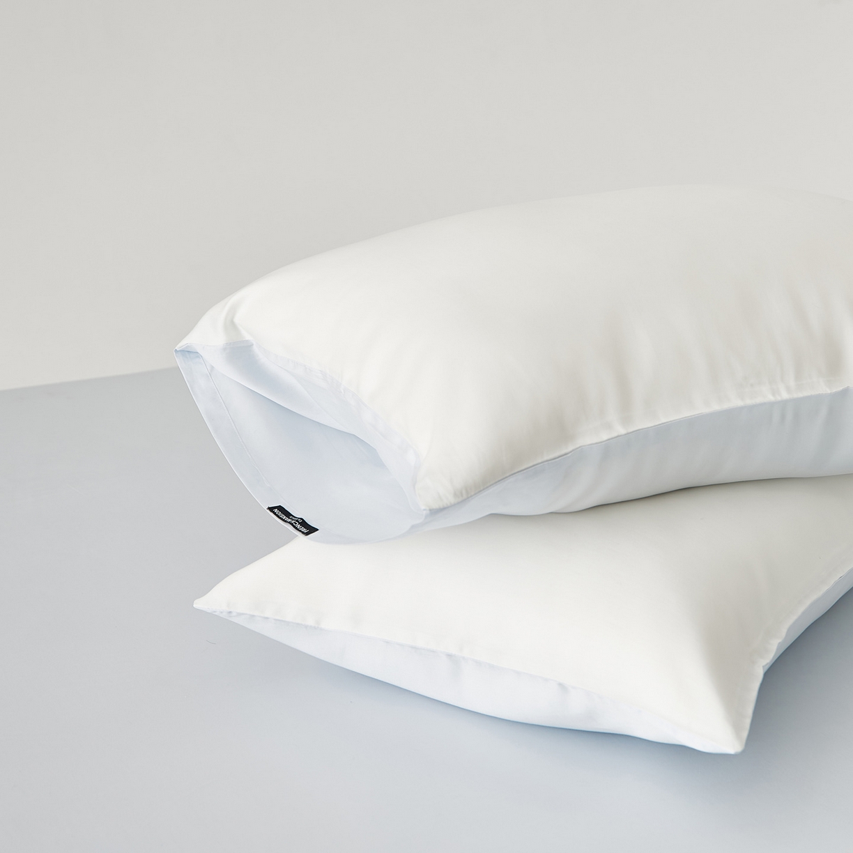 91家纺网 家纺一手货源 找家纺 EH家居 2026春夏新款简约纯色天丝单品枕套（AB版）（被套同款） 仲夏-浅云白