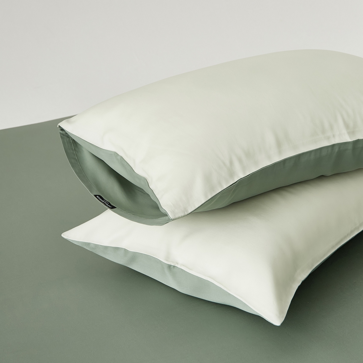 91家纺网 家纺一手货源 找家纺 EH家居 2026春夏新款简约纯色天丝单品枕套（AB版）（被套同款） 仲夏-仲夏夜绿