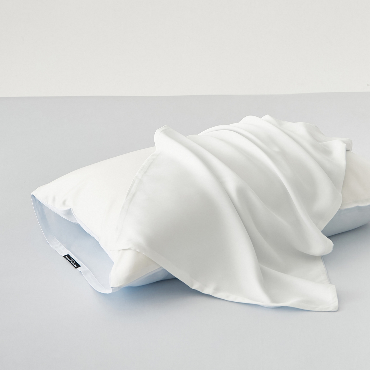 91家纺网 家纺一手货源 找家纺 EH家居 2026春夏新款简约纯色天丝单品枕套（AB版）（被套同款） 仲夏-浅云白