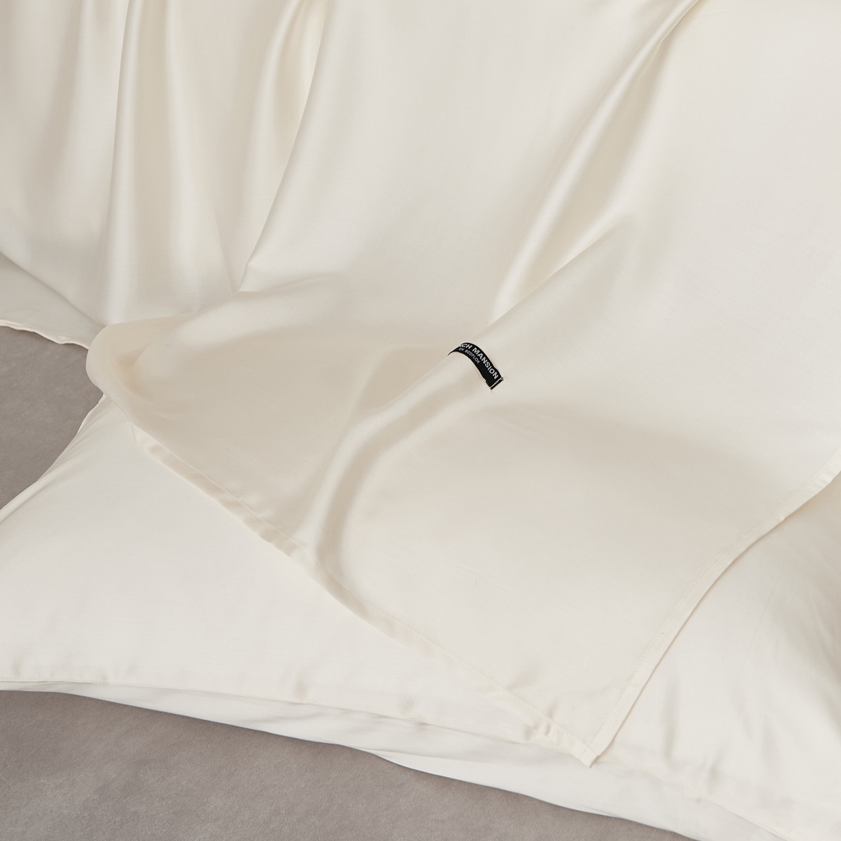 91家纺网 家纺一手货源 找家纺 EH家居 2026春夏新款简约纯色天丝单品床单 珍珠米白