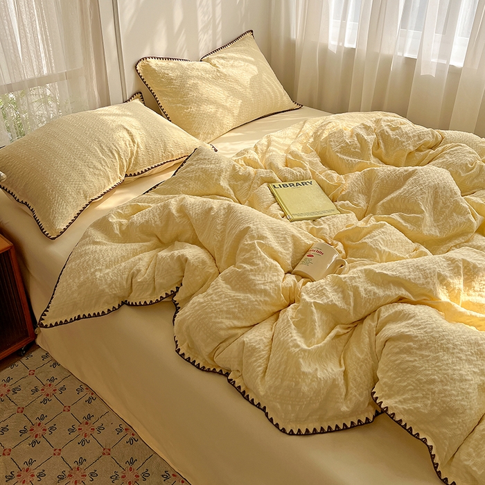 91家纺网 家纺一手货源 找家纺 仟网汇 2026新款泡泡纱三角针四件套--纯色系列 奶油黄