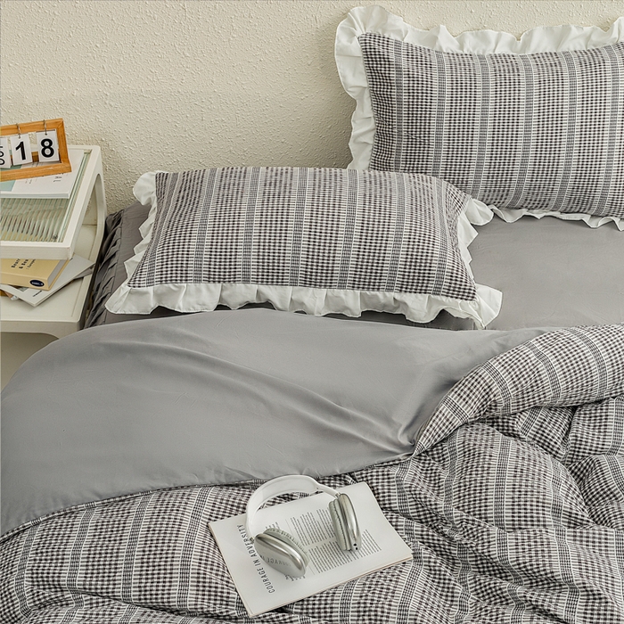 91家纺网 家纺一手货源 找家纺 恩和家纺 2026新款格子泡泡纱荷叶边四件套床单款床裙款套件 阳离子黑色