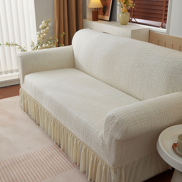 91家纺网 家纺一手货源 找家纺 飞翔家纺沙发套 2026新款素格纹裙摆沙发套 米白色
