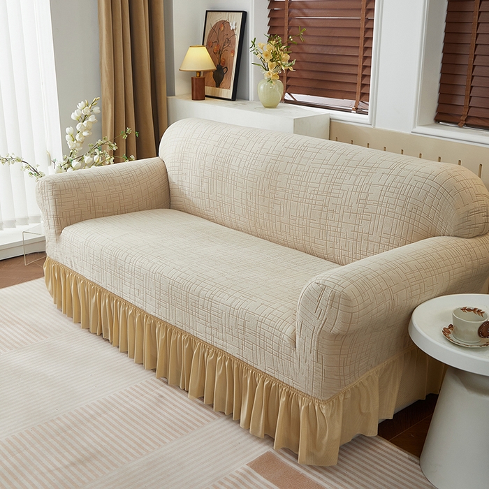 91家纺网 家纺一手货源 找家纺 飞翔家纺沙发套 2026新款素格纹裙摆沙发套 米黄色