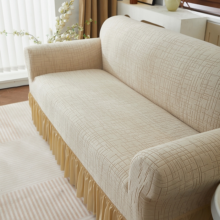 91家纺网 家纺一手货源 找家纺 飞翔家纺沙发套 2026新款素格纹裙摆沙发套 米黄色